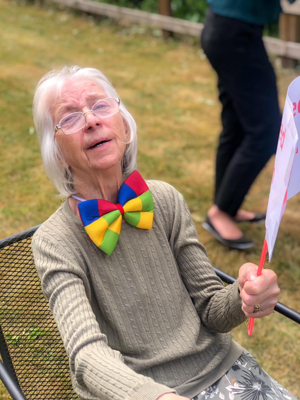 Sally enjoying sports day in a clown bow tie 